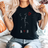 Women's black t-shirt with couple and initials.